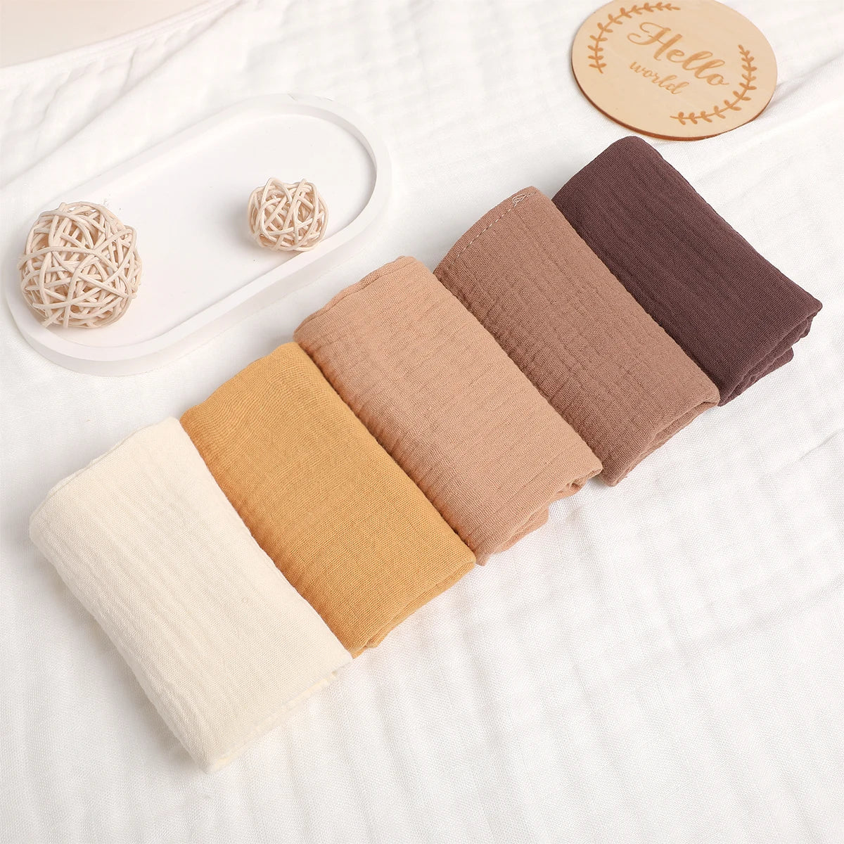1. “Stack of 6-layer organic cotton baby washcloths in neutral colors”
2. “Soft and absorbent eco-friendly baby washcloths set”
3. “Close-up of breathable 100% cotton fabric texture”
4. “Baby towel used as a burp cloth on a newborn’s shoulder”
5. “Folded pure cotton baby wipes laid on a clean surface”