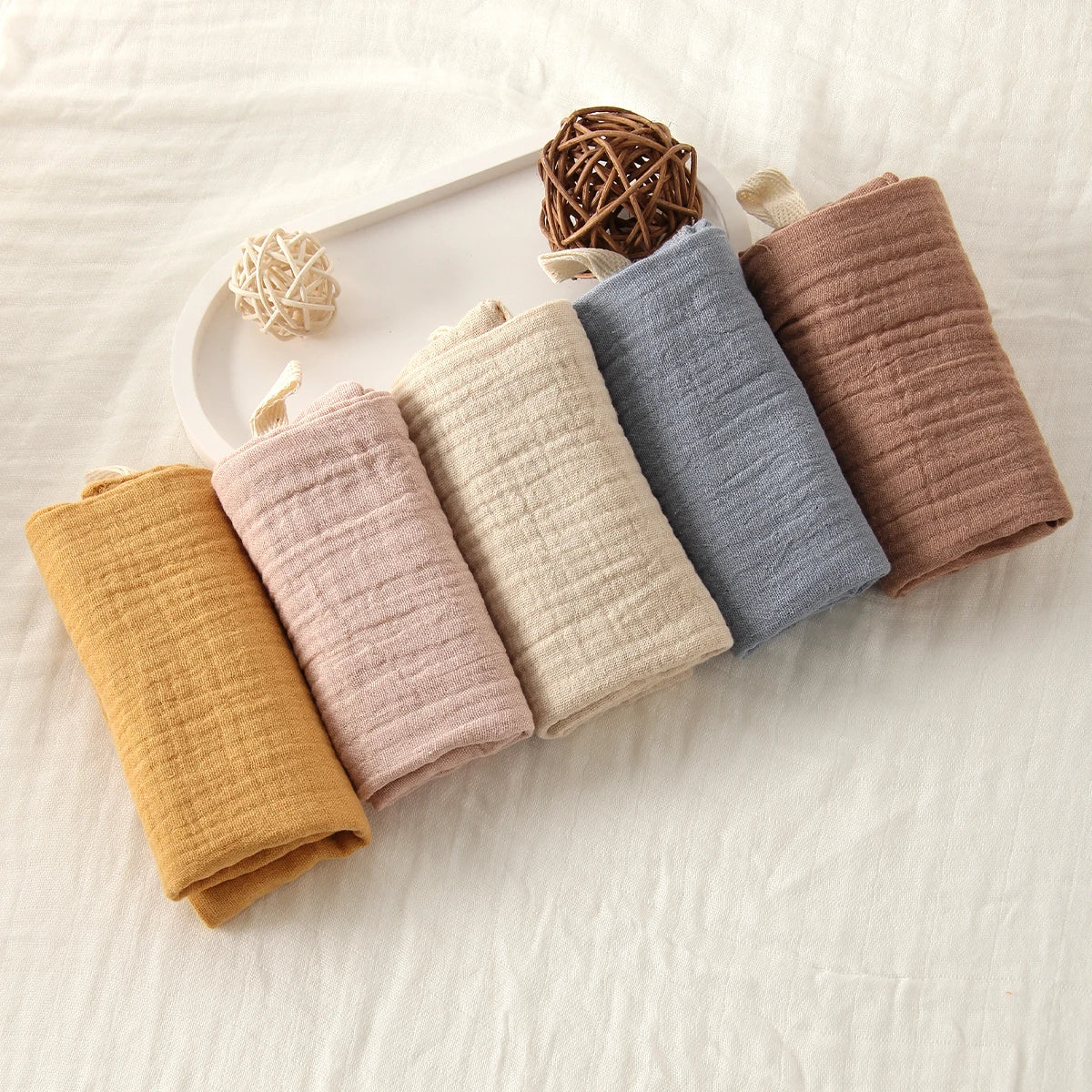 1. “Stack of 6-layer organic cotton baby washcloths in neutral colors”
2. “Soft and absorbent eco-friendly baby washcloths set”
3. “Close-up of breathable 100% cotton fabric texture”
4. “Baby towel used as a burp cloth on a newborn’s shoulder”
5. “Folded pure cotton baby wipes laid on a clean surface”