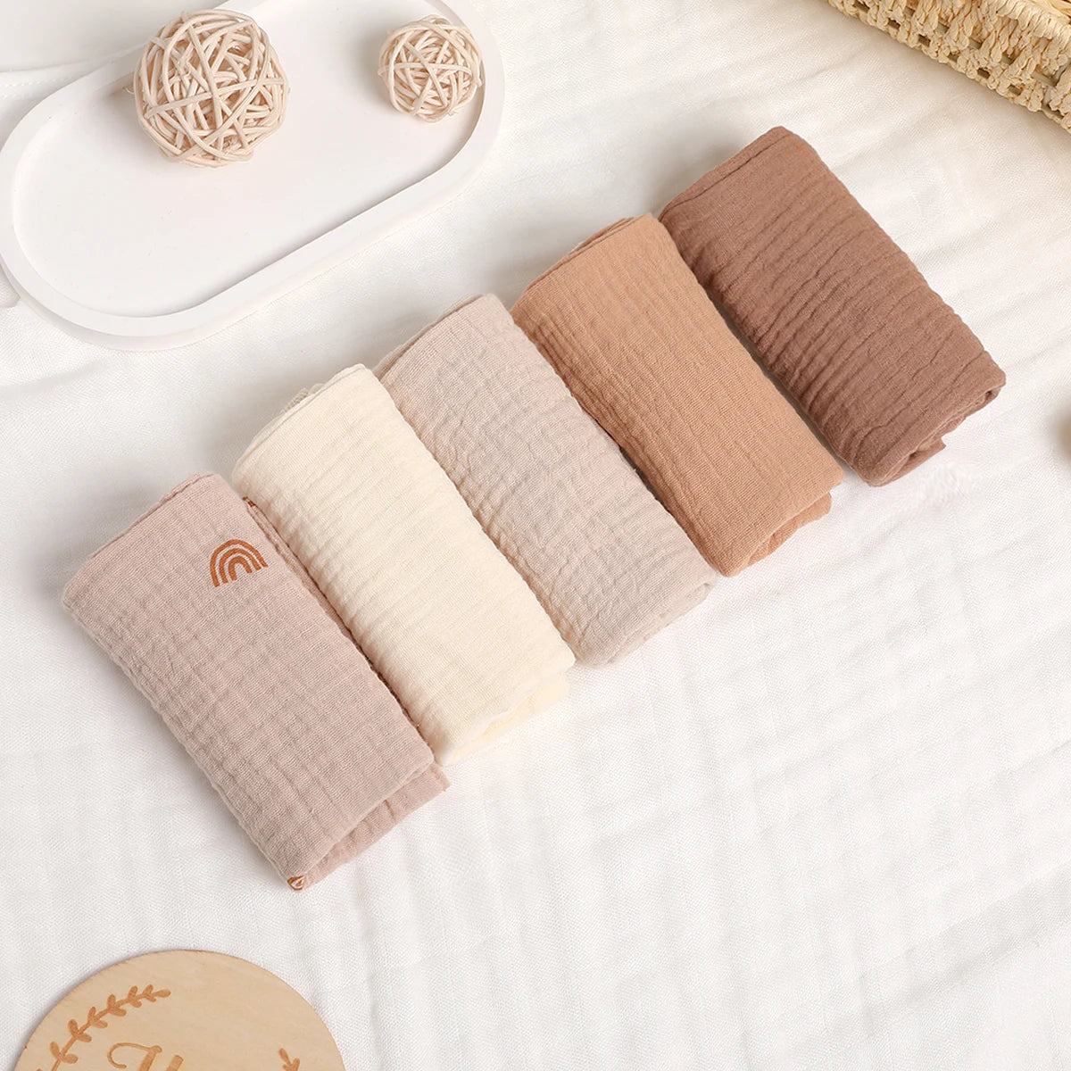1. “Stack of 6-layer organic cotton baby washcloths in neutral colors”
2. “Soft and absorbent eco-friendly baby washcloths set”
3. “Close-up of breathable 100% cotton fabric texture”
4. “Baby towel used as a burp cloth on a newborn’s shoulder”
5. “Folded pure cotton baby wipes laid on a clean surface”