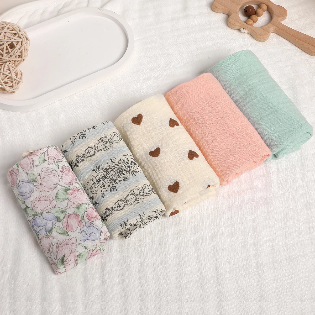 1. “Stack of 6-layer organic cotton baby washcloths in neutral colors”
2. “Soft and absorbent eco-friendly baby washcloths set”
3. “Close-up of breathable 100% cotton fabric texture”
4. “Baby towel used as a burp cloth on a newborn’s shoulder”
5. “Folded pure cotton baby wipes laid on a clean surface”