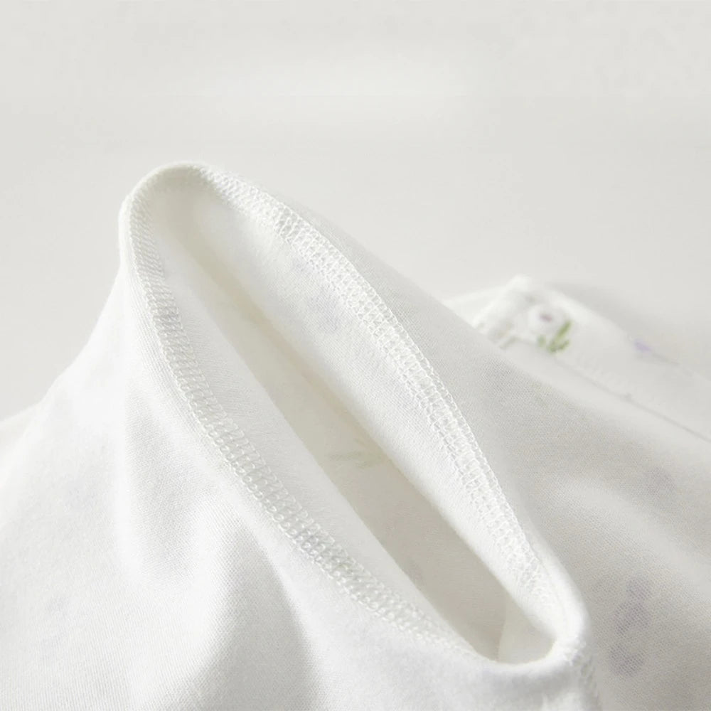 Close-up of a white shirt collar on a light gray background