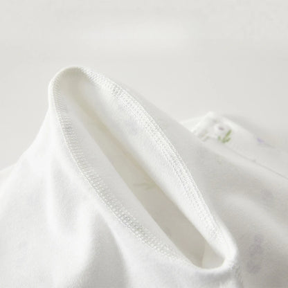 Close-up of a white shirt collar on a light gray background