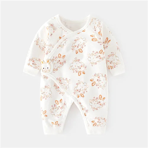 Baby onesie with floral and bunny pattern on a white background