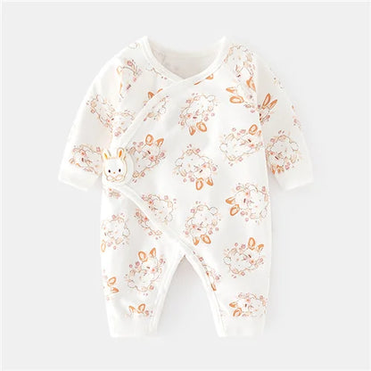 Baby onesie with floral and bunny pattern on a white background